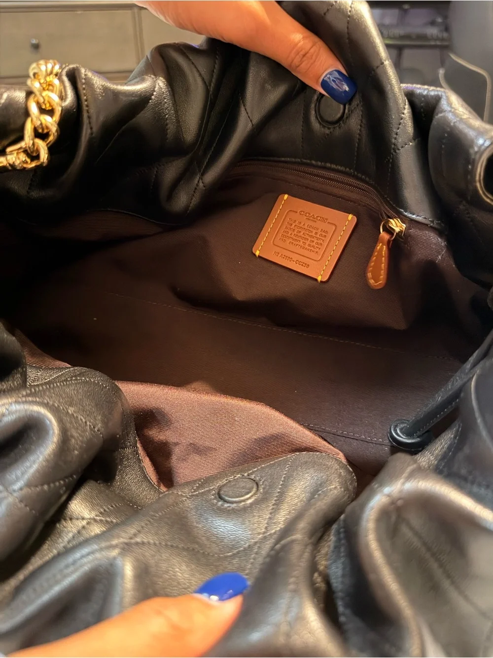 Coach Black Quilted Shoulder Bag with Gold Chain Accent